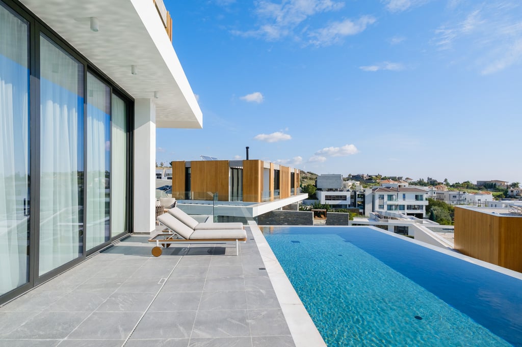 Apartment terrace with pool and skyline view