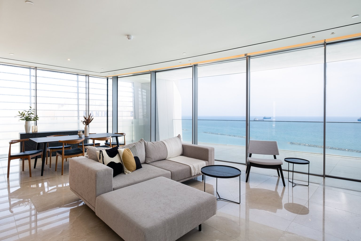 Modern sea-view apartment interior with large windows